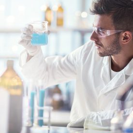 Scientist Holding PYREX beaker