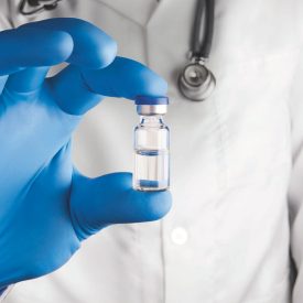 Vial in a Doctor's Hand