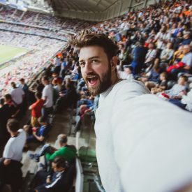 Happy person in Stadion with 5G coverage